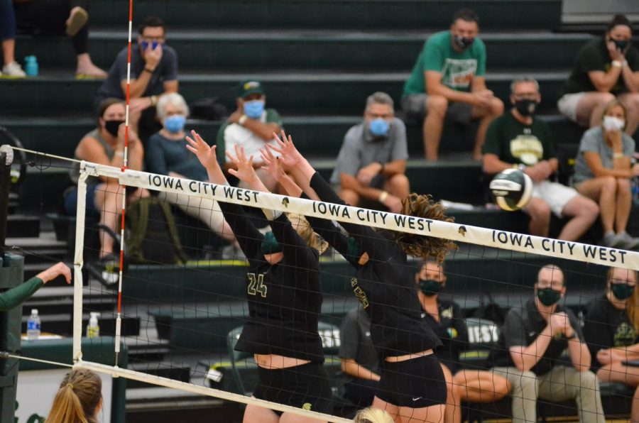 McKenna Proud '21 reaches for a block against Kennedy on Aug. 25.