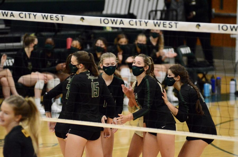 The team celebrates a point against Kennedy on Aug. 25.