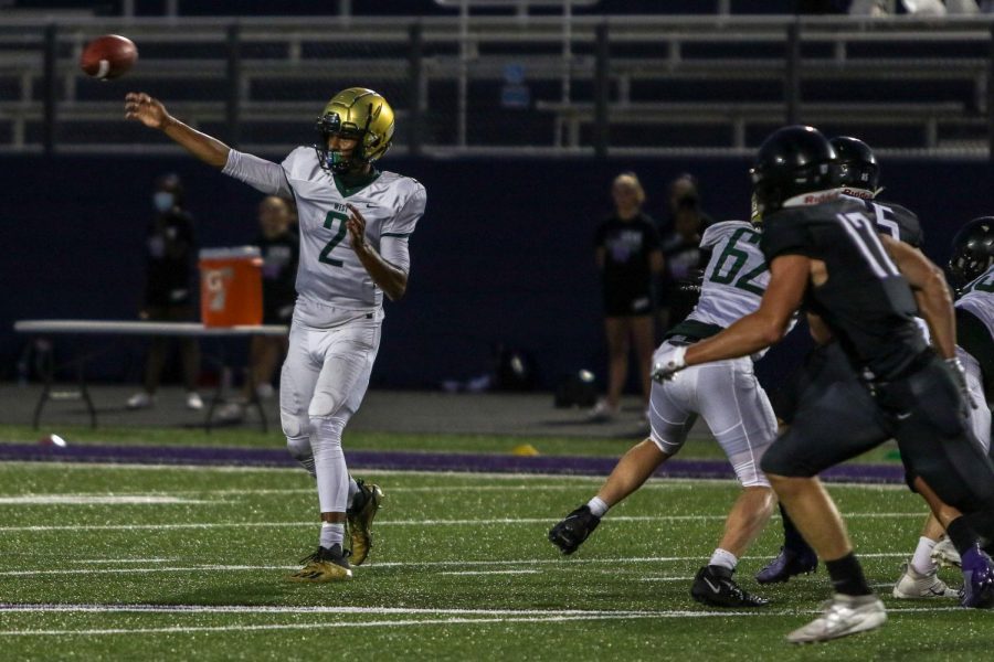 Marcus Morgan '21 throws a pass downfield against Liberty on Aug. 28.