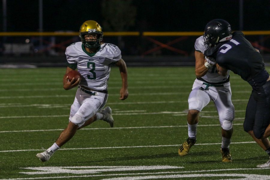 Trey King '21 gets outside on a run against Liberty on Aug. 28.