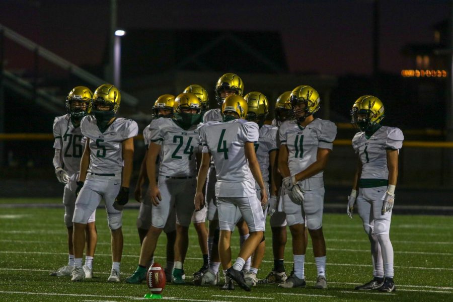 Kicker Owen Smith '21 prepares to kickoff against Liberty on Aug. 28.