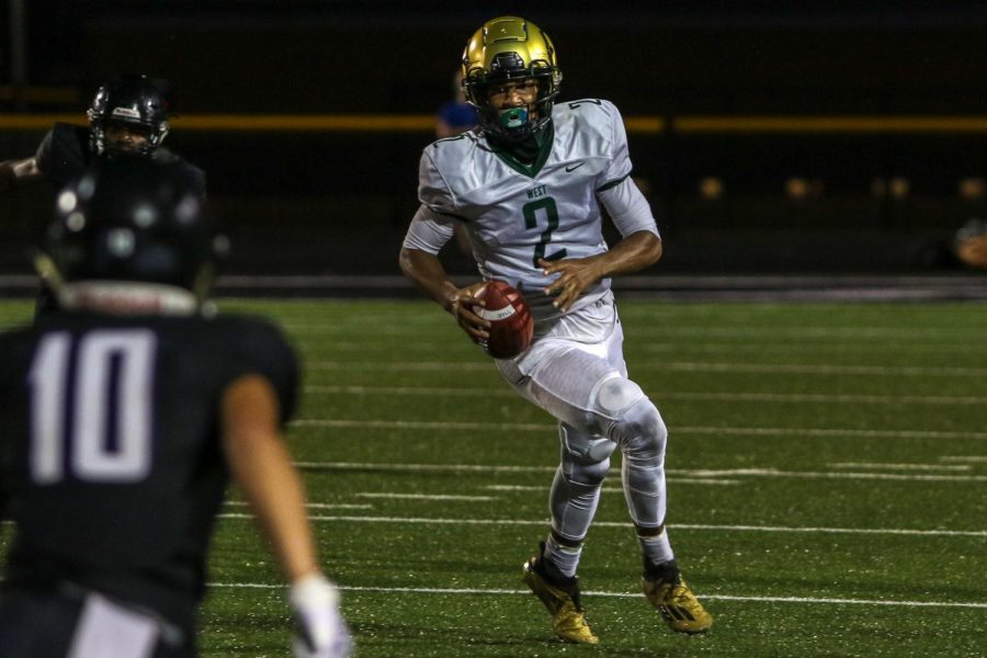 Marcus Morgan '21 scrambles out of the pocket against Liberty on Aug. 28.