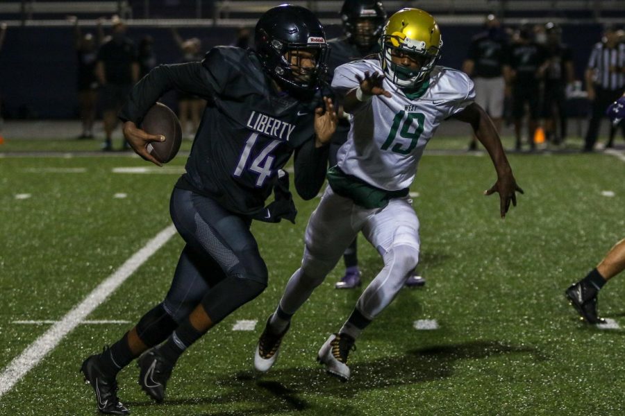 Mo Simpson '21 reaches for a sack against Liberty on Aug. 28.