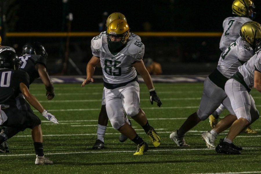 Brett Pelfrey '22 looks to block against Liberty on Aug. 28.