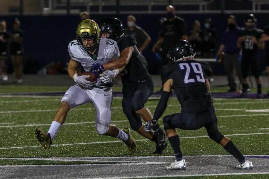 Grahm Goering '21 secures a first down catch against Liberty on Aug. 28.