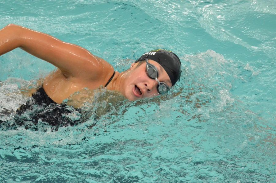 Aurora Roghair 21 swims freestyle during the meet against Dubuque Wahlert Sept. 29. Roghair swam a state qualifying time in the 200 IM and 100 backstroke.  
