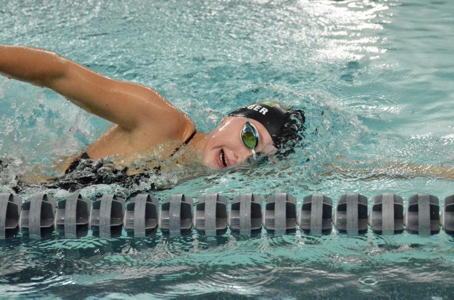 Olivia Taeger 22 cools down after the 200 medley relay Sept. 29.