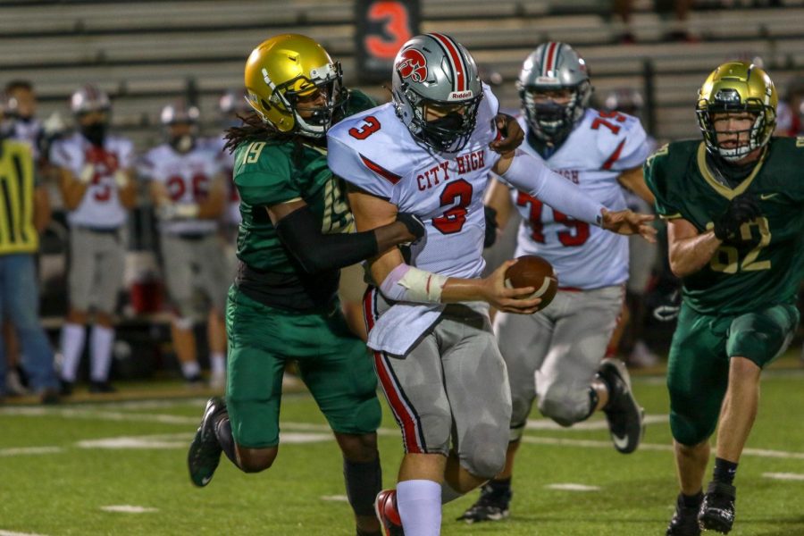 Mo Simpson '21 sacks City High quarterback Raph Hamilton '21 during the Battle for the Boot on Sept. 4.