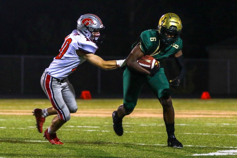 Mikey Brown '21 breaks a tackle during the Battle for the Boot on Sept. 4.