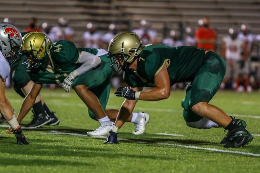 Alex McKay '21 lines up at defensive end during the Battle for the Boot on Sept. 4.