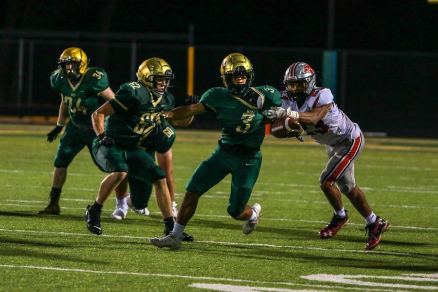 Trey King '21 breaks a tackle during the Battle for the Boot on Sep. 4.