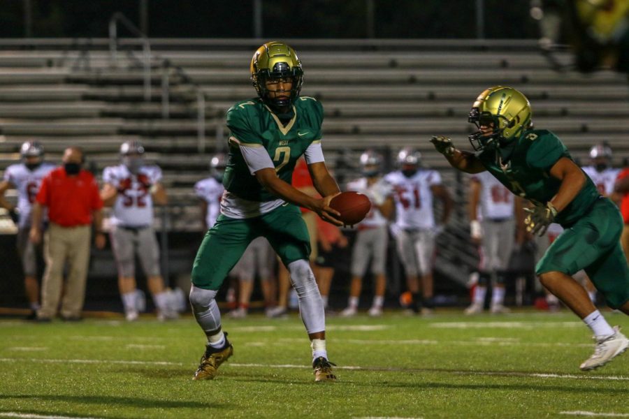 Marcus Morgan '21 runs the run pass option during the Battle for the Boot on Sept. 4.