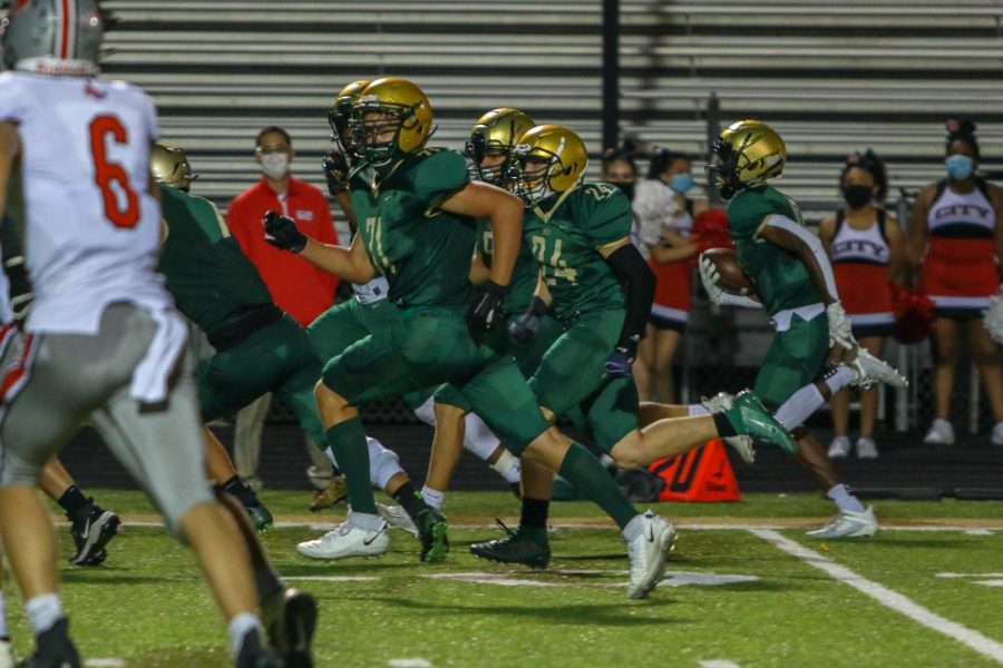 Damarion Williams '21 returns his interception for a touchdown during the Battle for the Boot on Sept. 4.