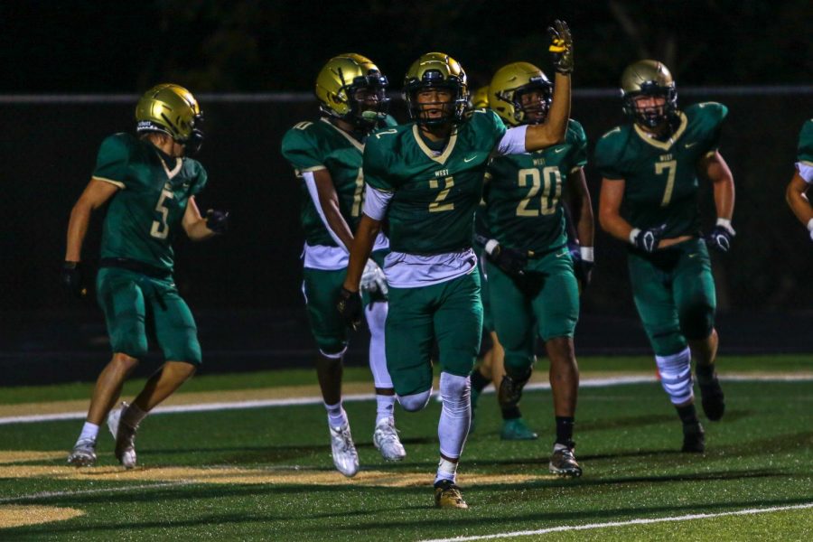 Marcus Morgan '21 celebrates after a West High pick-six during the Battle for the Boot on Sep. 4.