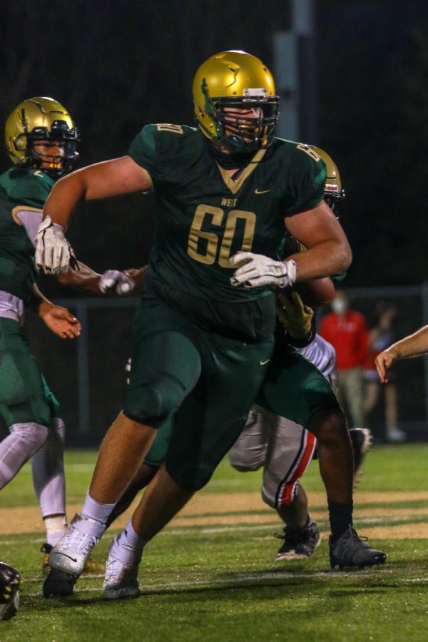 Liam Becher '22 looks to block during the Battle for the Boot on Sept. 4.