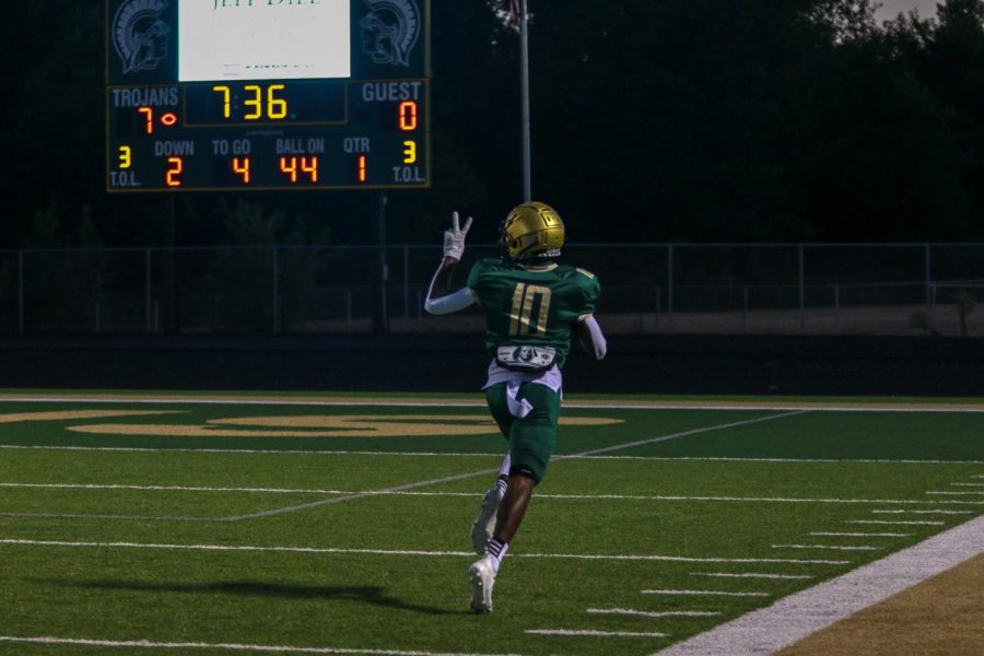 Damarion Williams '21 celebrates as he runs for a touchdown during the Battle for the Boot on Sept. 4.