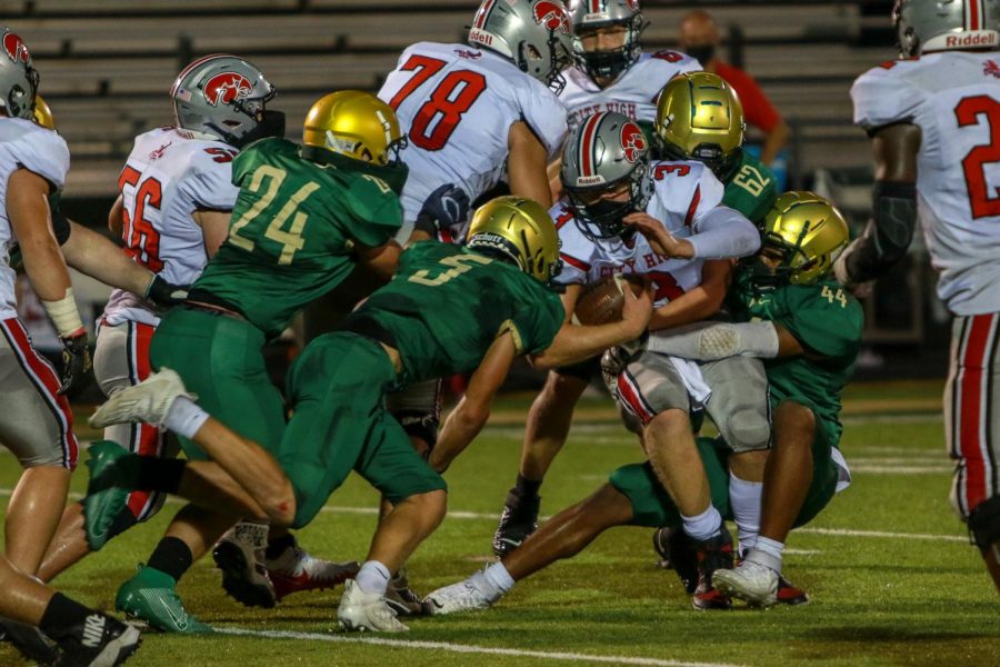 Mason Applegate '22 and Will Towler '22 team up for a sack during the Battle for the Boot on Sept. 4.