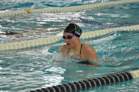 Lauren Trent 22 swims breaststroke during the 200 IM Sept. 29 against Dubuque Wahlert. Trent finished with a time of 2:21.88.