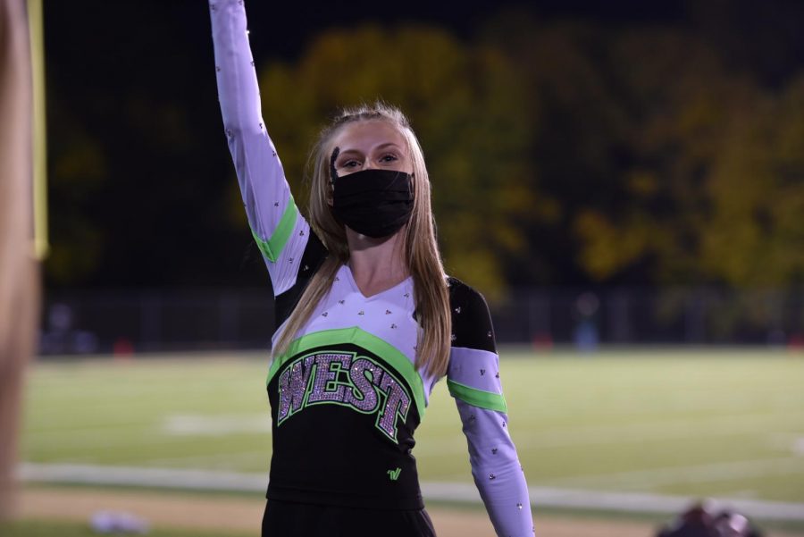 Junior Liv Casebolt engages with the student section at West on Oct. 10. 