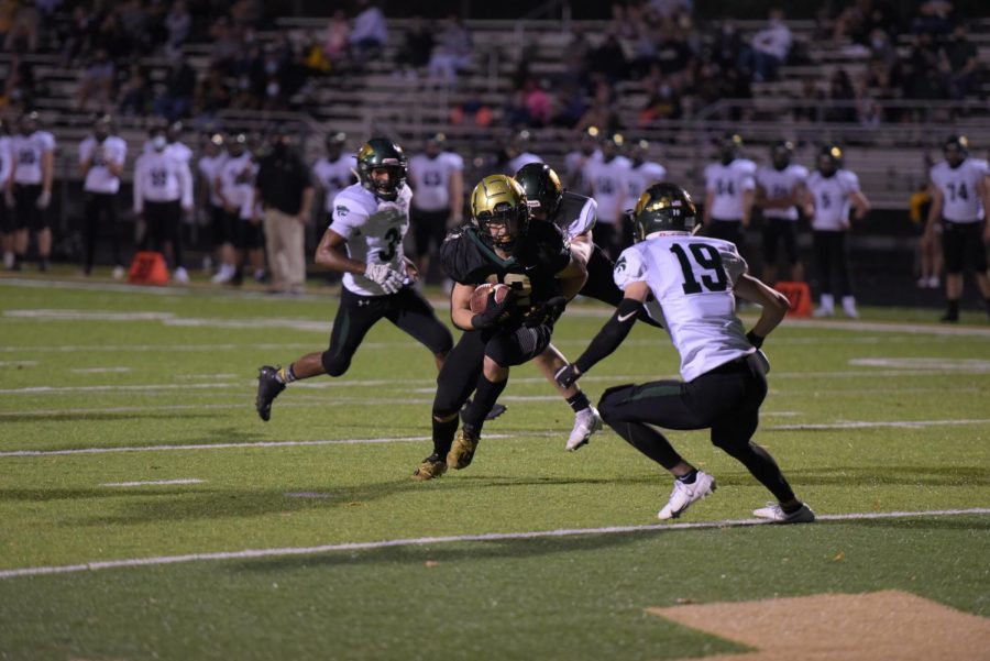 Grahm Goering 21 drives past the Cougars defense into the endzone at West on Oct. 10. 