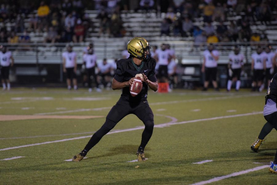 Marcus Morgan 21 looks downfield to throw to target wide reciever, Grahm Goering 21 against Kennedy on Oct. 10.