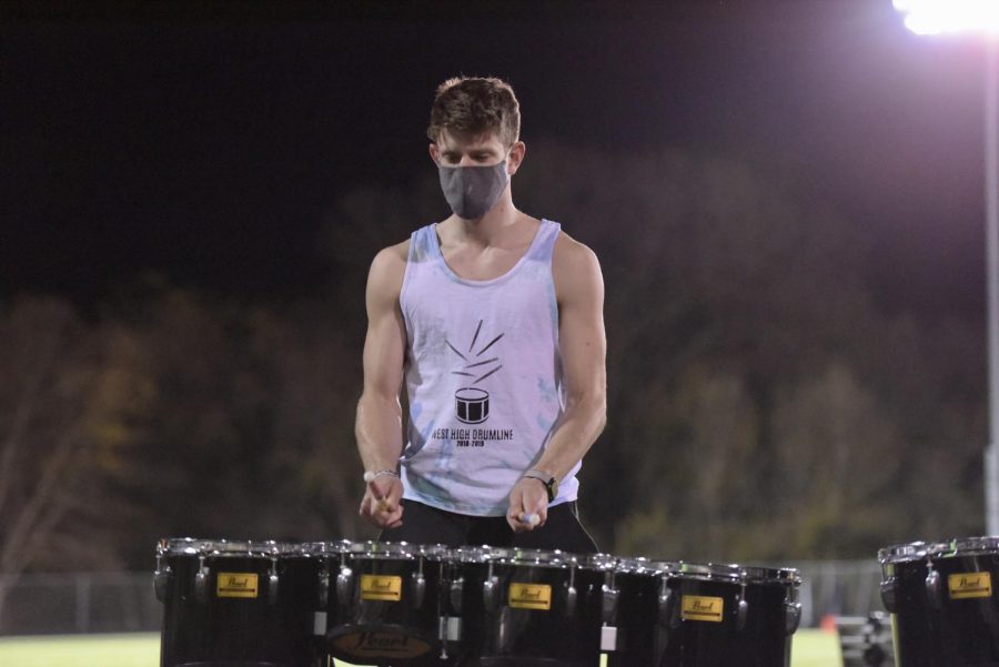 BJ Wolf 21 plays the drums with his fellow drumline mates Oct. 23. 
