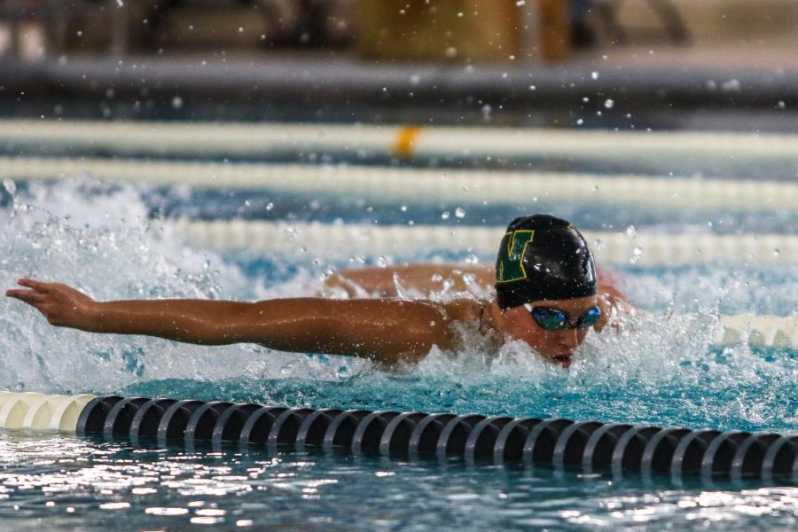 Scarlet Martin '22 swims in the 200 medley relay at the Mercer Park Aquatic Center Oct. 17.