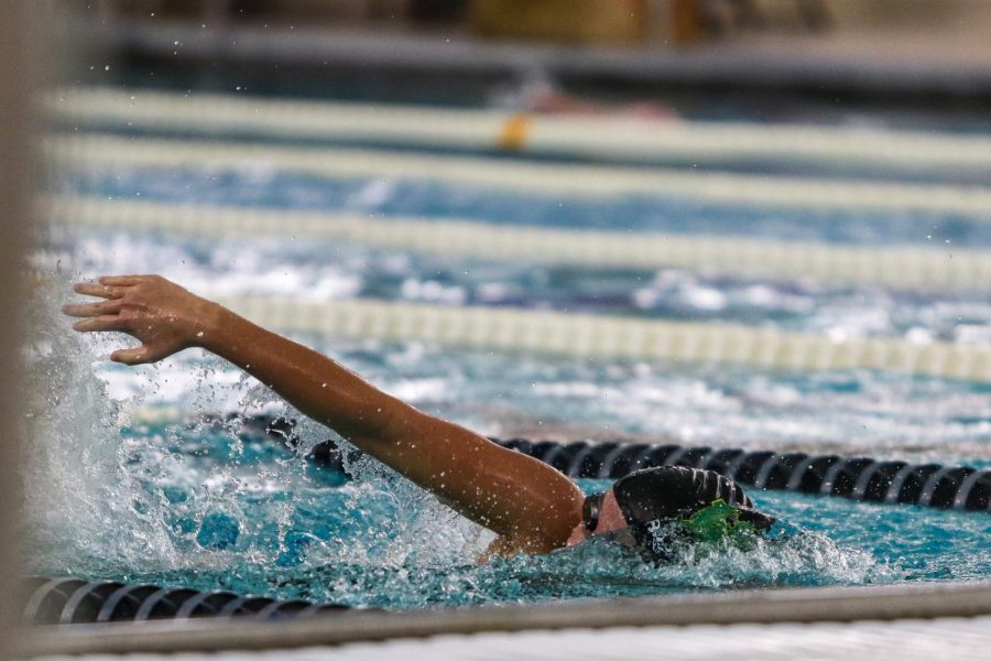 Jade Roghair '23 swims in the 200 freestyle relay at the Mercer Park Aquatic Center Oct. 17.