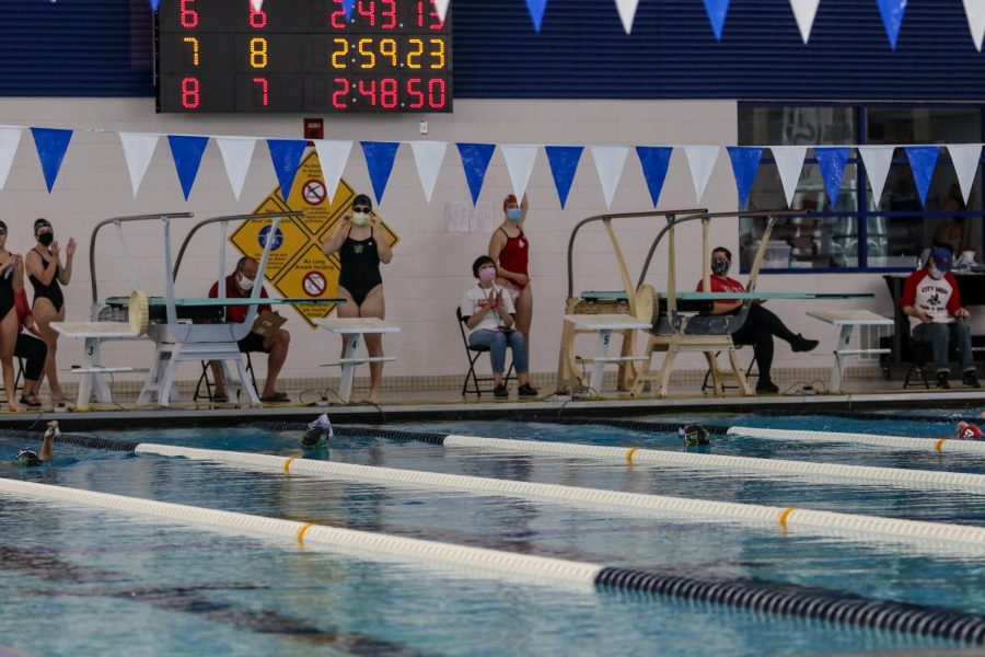 Trojan Bolt swimmers swim to the other side of the pool after their race as a new COVID-19 precaution at the Mercer Park Aquatic Center Oct. 17.