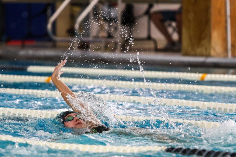 Olivia Taeger '22 swims backstroke in the 200 IM at the Mercer Park Aquatic Center Oct. 17.