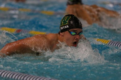 Nathan Deyak 21 swims in the 100 Butterfly against Waterloo on Dec. 15 at the Coralville Rec Center.