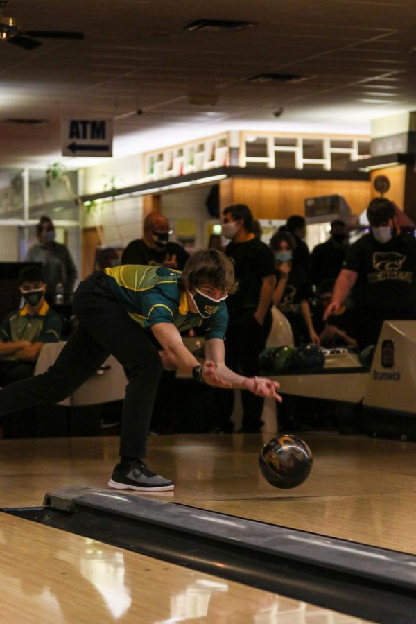 Caden Noeller '22 keeps a close eye on his ball as he bowls against Kennedy on Dec. 18.