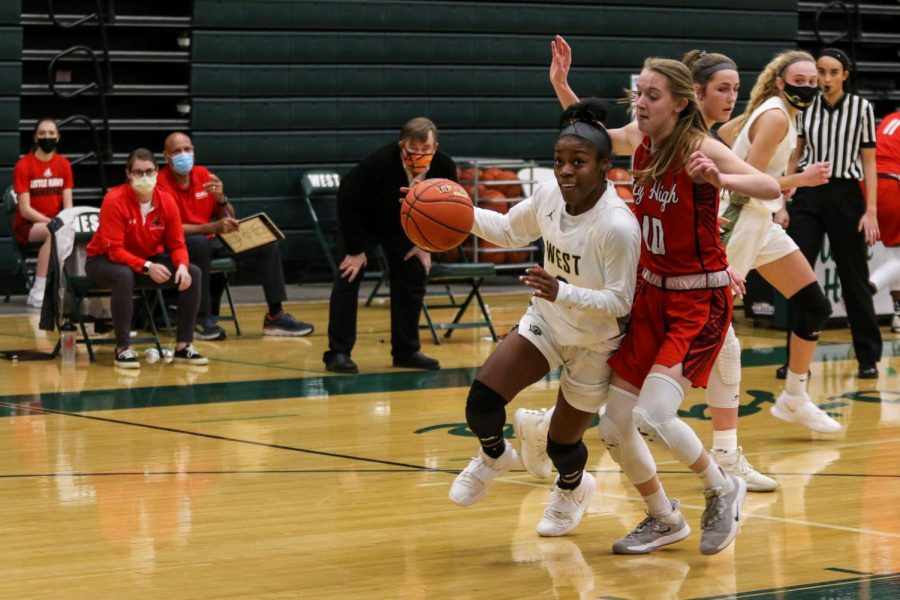 Matayia Tellis '21 turns the corner looking to score against City High on Dec. 18.