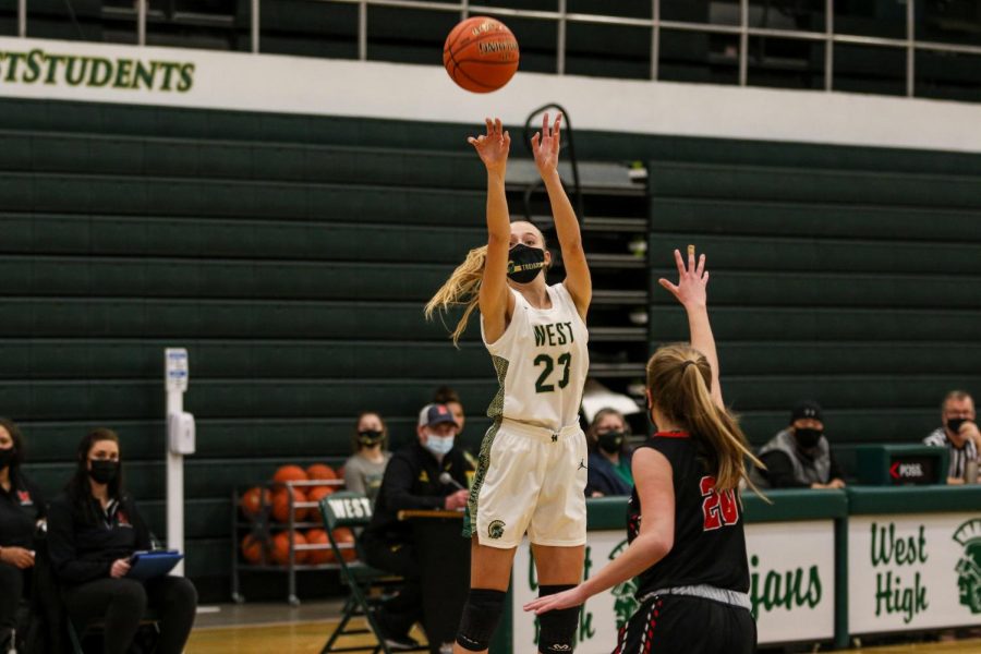 Audrey Koch '21 shoots a three pointer against Linn-Mar on Dec. 22. 