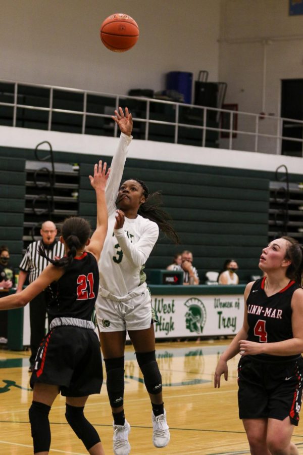 Matayia Tellis '21 shoots a floater against Linn-Mar on Dec. 22. 