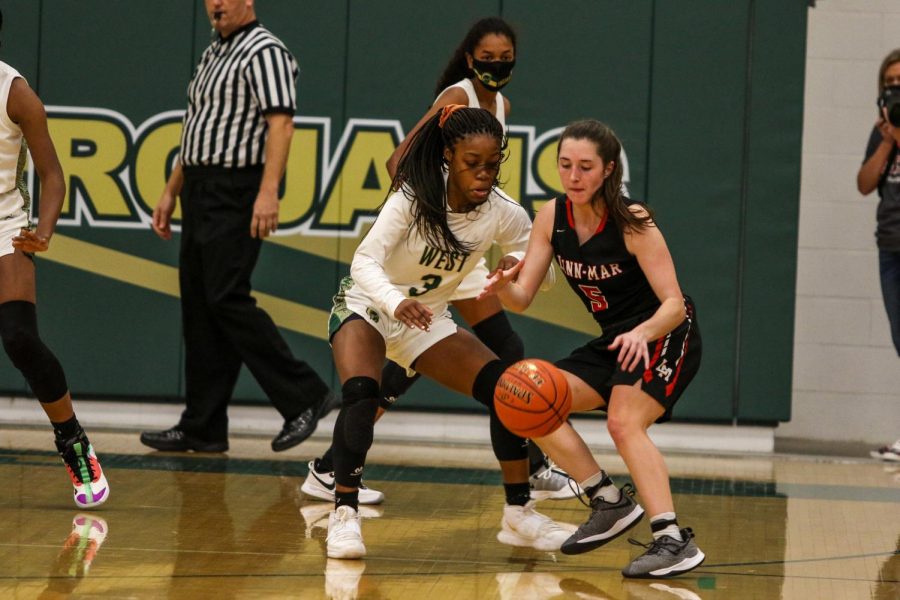 Matayia Tellis '21 fights for a steal against Linn-Mar on Dec. 22. 