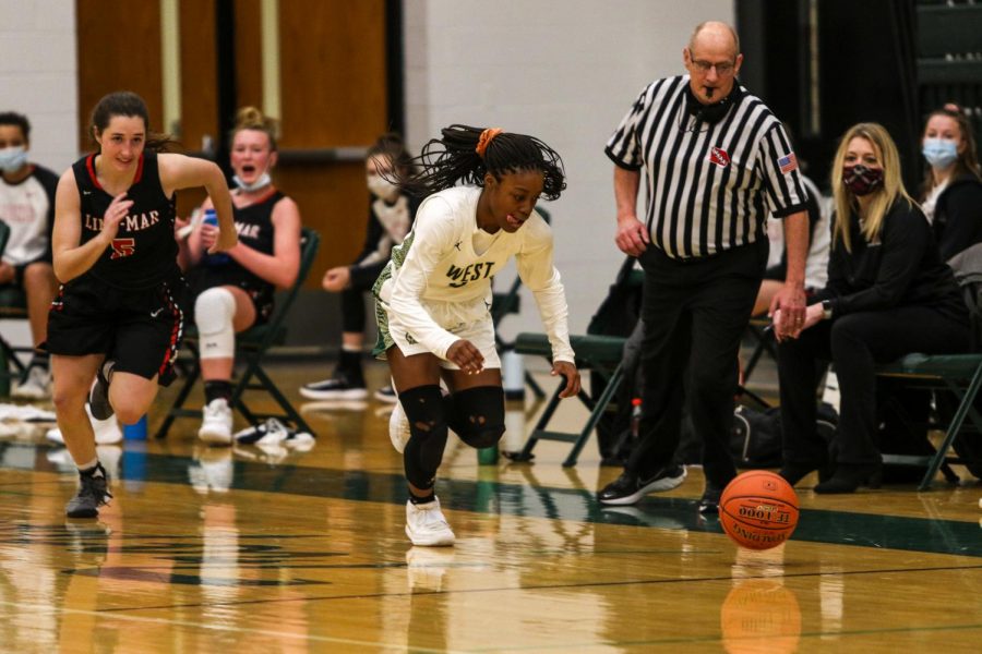 Matayia Tellis '21 chases down a loose ball against Linn-Mar on Dec. 22. 