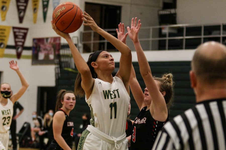 Liv Williams '21 goes up for a layup against Linn-Mar on Dec. 22. 