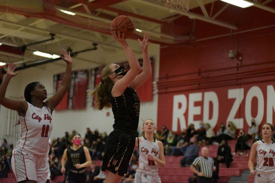 Anna Prouty 23 makes a fast break layup against City Jan. 22.