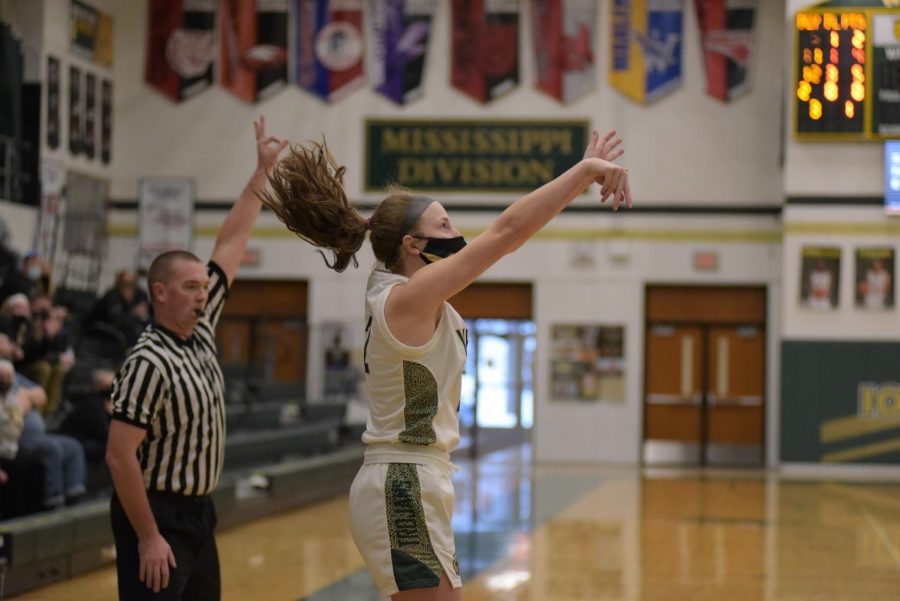 Lucy Wolf ‘24 takes a three point shot Jan. 2 against Southeast Polk.