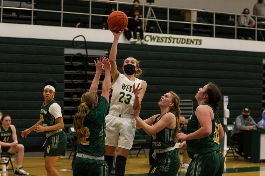 Audrey Koch '21 knocks down a last-second floater versus Dubuque Hempstead on Jan. 12.