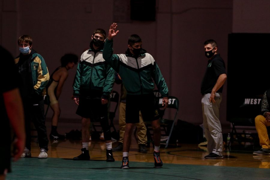 Hunter Garvin '22 waves to the fans as he is introduced against Hempstead on Jan. 21.