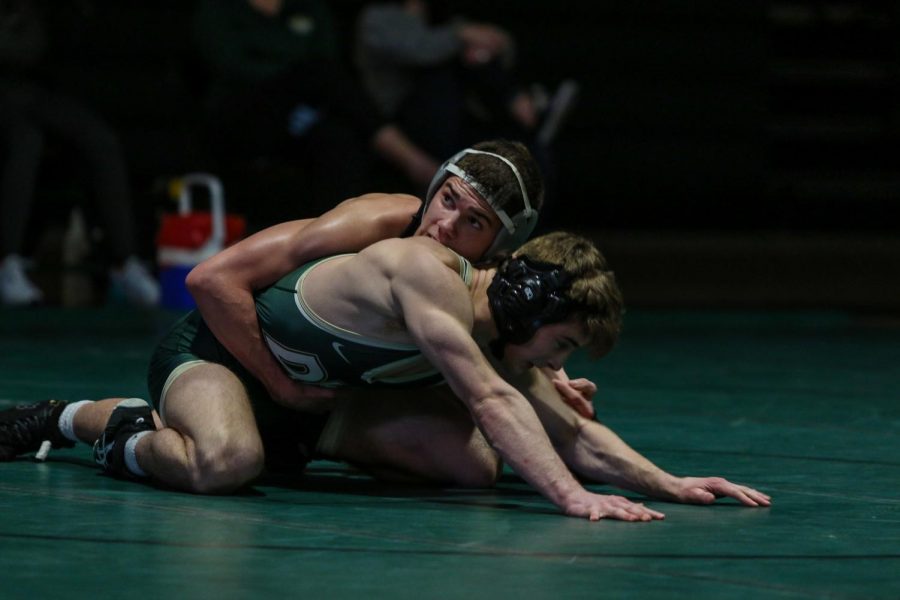 Graham Gambrall '21 looks at the clock as he looks for another takedown against Hempstead on Jan. 21.