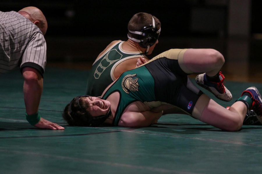 Mason Goodale '23 fights to keep the Trojans dual meet hopes alive against Hempstead on Jan. 21.