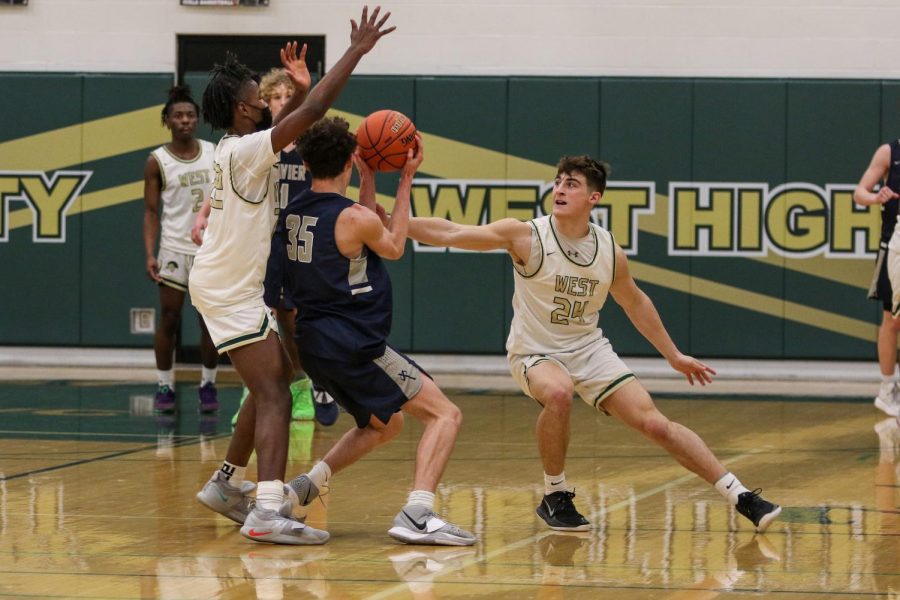 Grahm Goering '21 reaches for a steal against Xavier on Jan. 29.