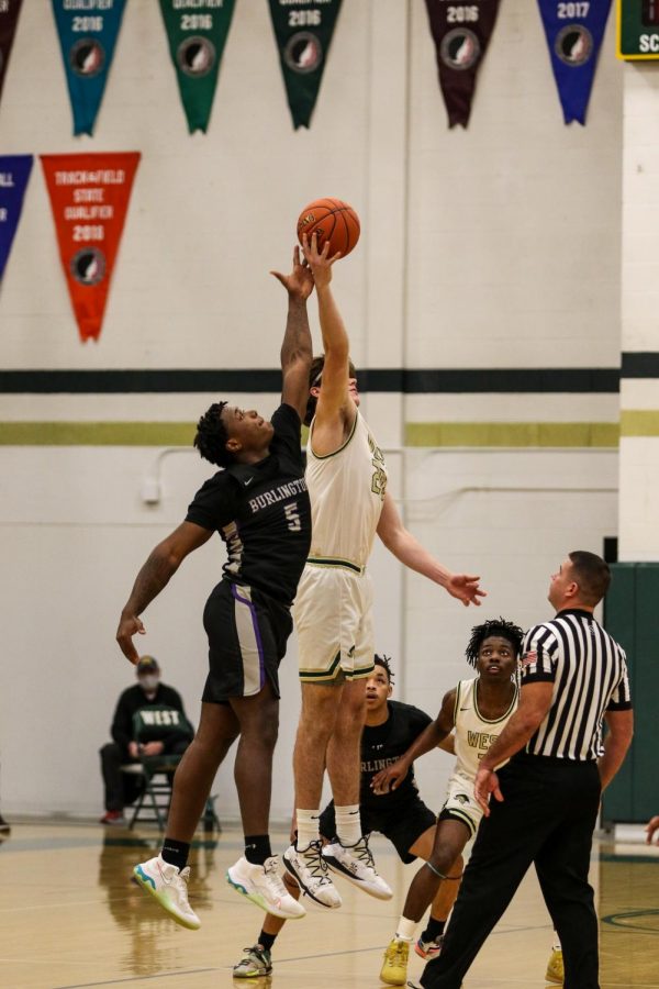 Pete Moe '22 wins the tip-off against Burlington on Jan. 2.