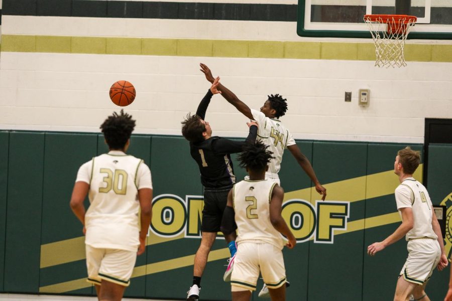 Antoine Tellis '22 blocks a Greyhound floater on Jan. 2.