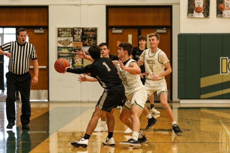 Grahm Goering '21 and Andrew Tauchen '21 look to trap against Burlington on Jan. 2.