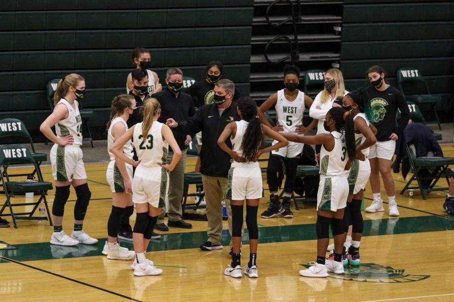 Head coach BJ Mayer addresses his team during a timeout against Fort Madison on Feb. 6.