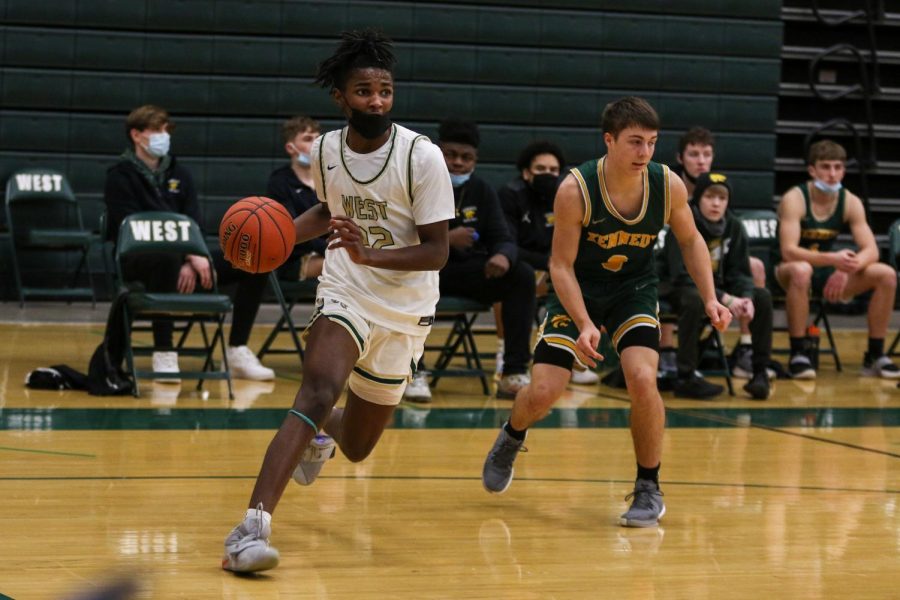 Kareem Earl '24 drives the baseline against Kennedy on Feb. 11.